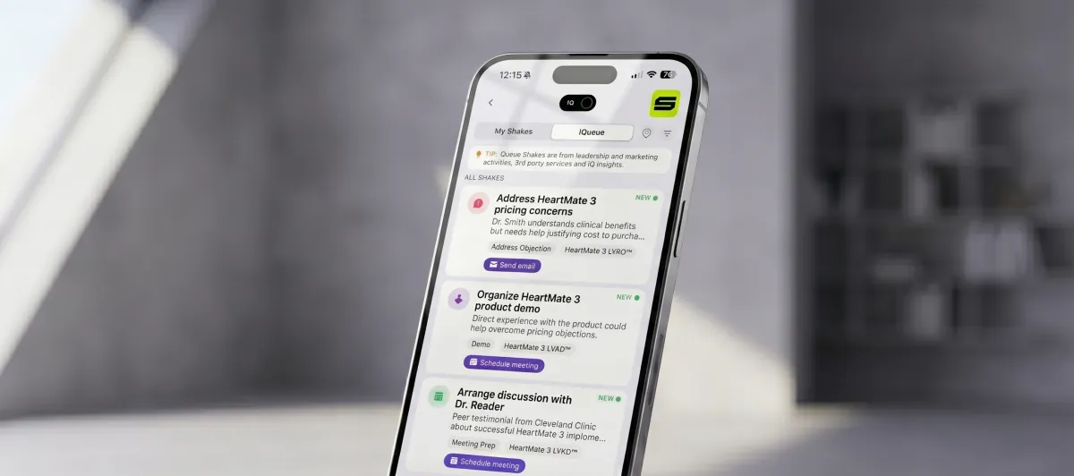 ShakeIQ on a phone — the rep's IQueue showing AI-suggested next-best actions: address pricing concerns, organize a product demo, arrange a peer reference discussion, each one tap away from being done.